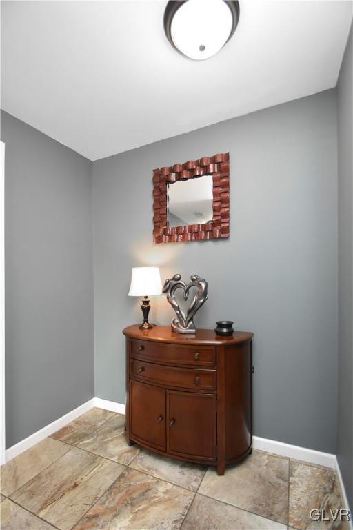 249 East Dell Road Bath, PA 18014 - Photo 27 of 50 a room with a chair and painting on a table