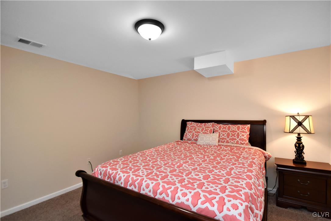 249 East Dell Road Bath, PA 18014 - Photo 29 of 50 a bedroom with a bed and a lamp on the dresser