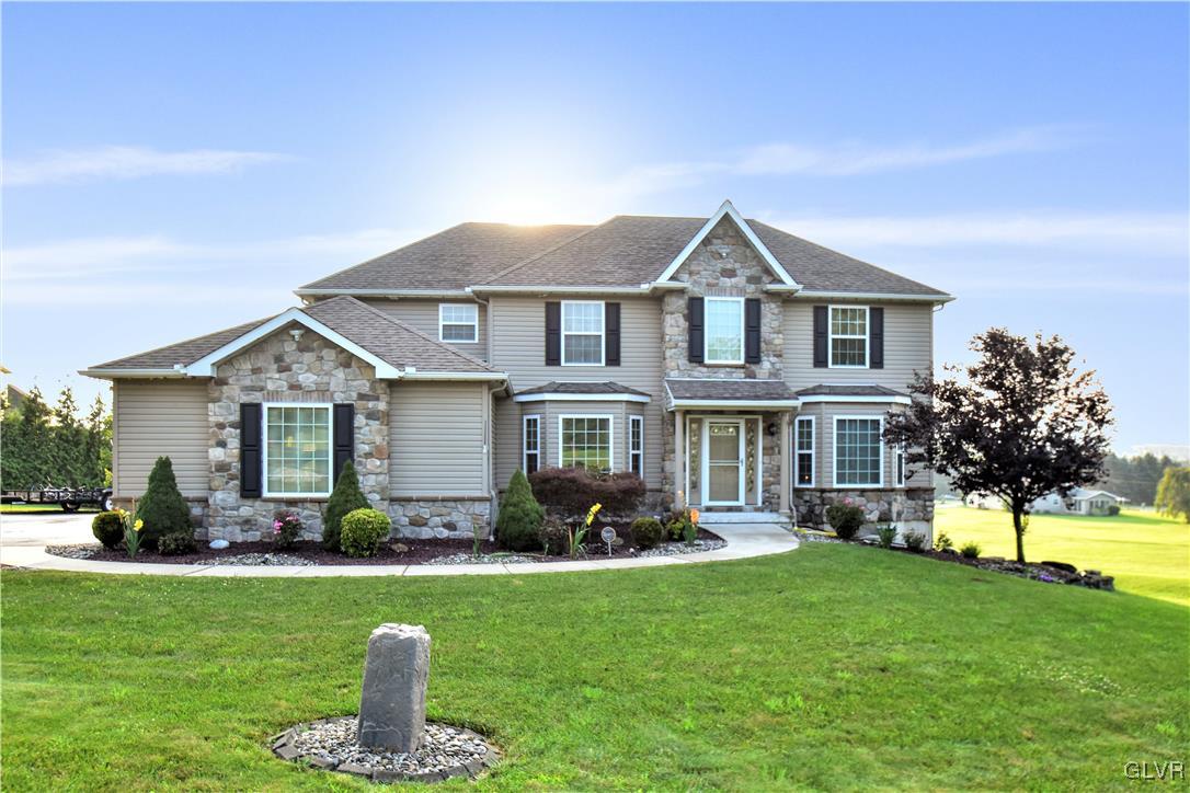 249 East Dell Road Bath, PA 18014 - Photo 3 of 50 a front view of a house with a garden and plants