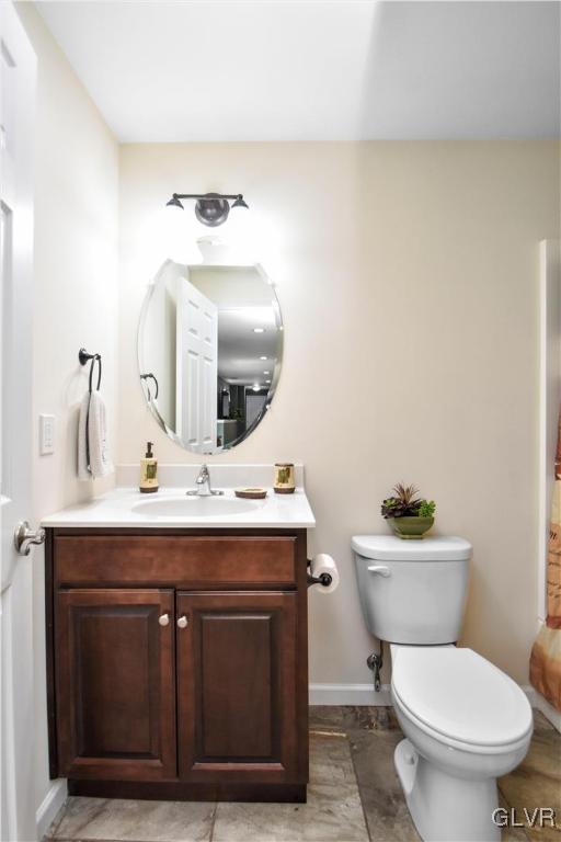 249 East Dell Road Bath, PA 18014 - Photo 35 of 50 a bathroom with a toilet a sink and mirror