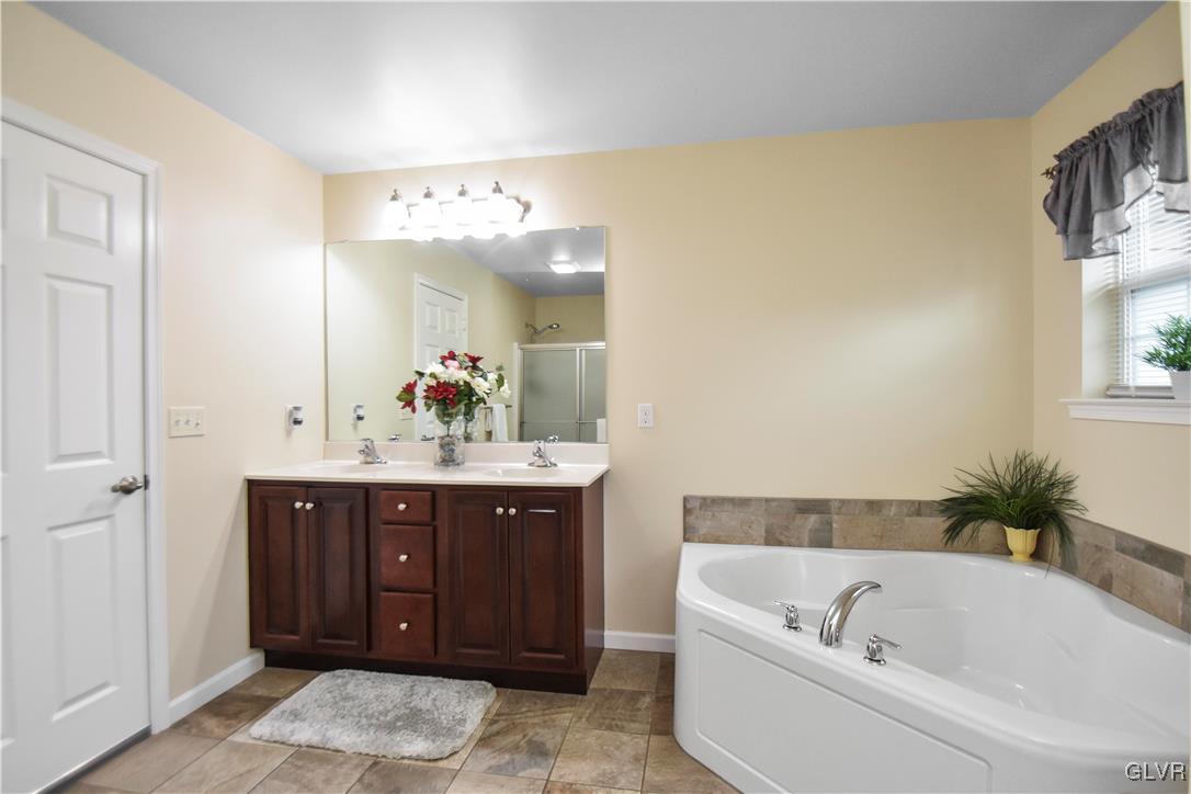 249 East Dell Road Bath, PA 18014 - Photo 44 of 50 a bathroom with a tub a sink and mirror