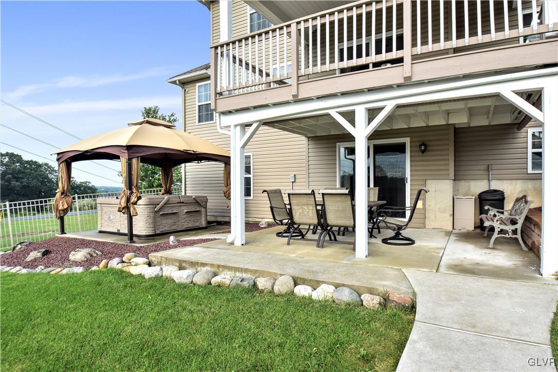 249 East Dell Road Bath, PA 18014 - Photo 48 of 50 a view of a patio with table and chairs under an umbrella