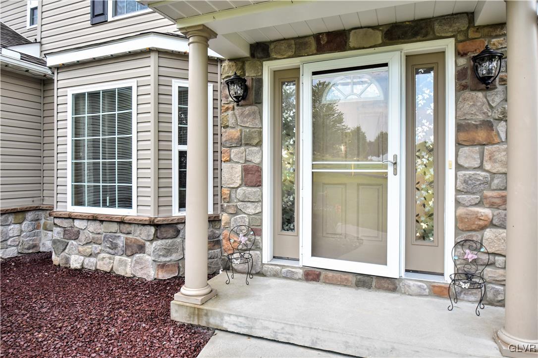 249 East Dell Road Bath, PA 18014 - Photo 5 of 50 a front view of a house with a glass door