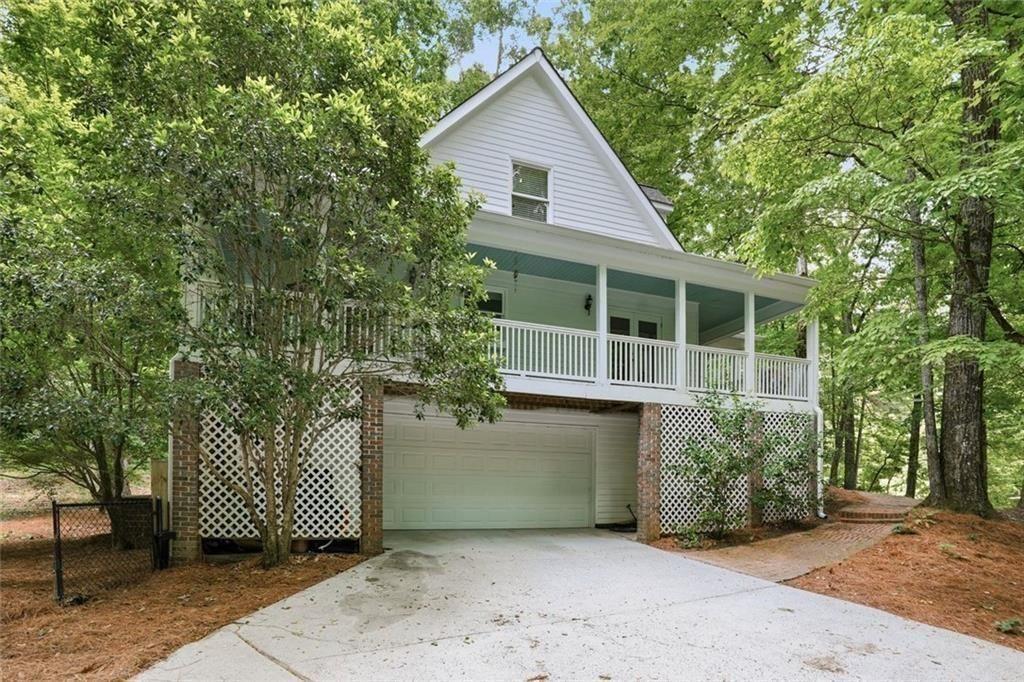 3259 Etchison Road Loganville, GA 30052 - Photo 42 of 50 a front view of a house with a garden