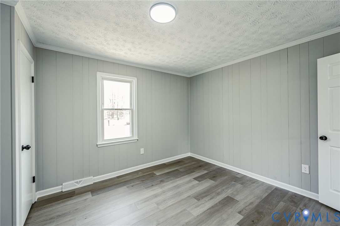 15412 Exter Mill Road Chesterfield, VA 23838 - Photo 61 of 66 Empty room with crown molding, light wood finished