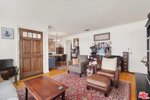 a living room with furniture and a rug