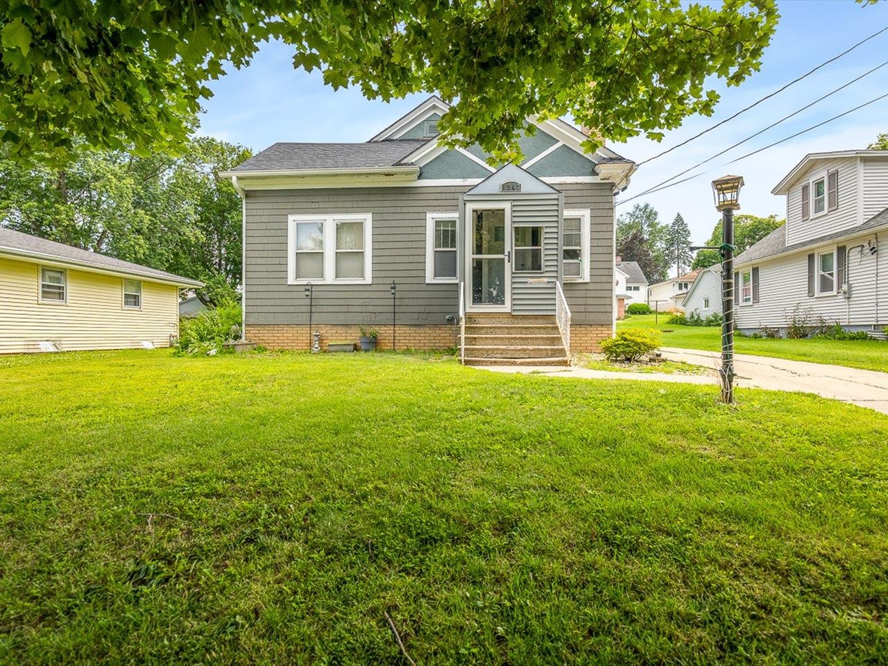 1247 West Logan Street Freeport, IL 61032 - Photo 2 of 34 a view of a house with a yard and sitting area