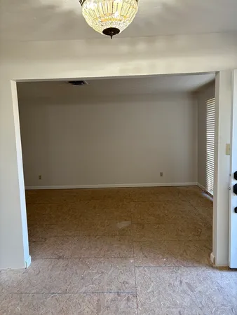 a view of room and an empty room