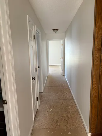 an empty room with a empty space and a window