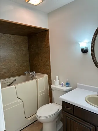 a kitchen with stainless steel appliances a sink stove and cabinets
