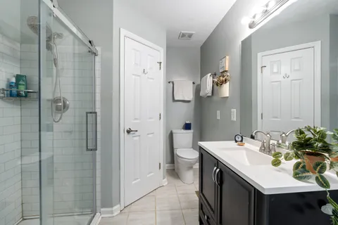 a bathroom with a sink double vanity and a shower