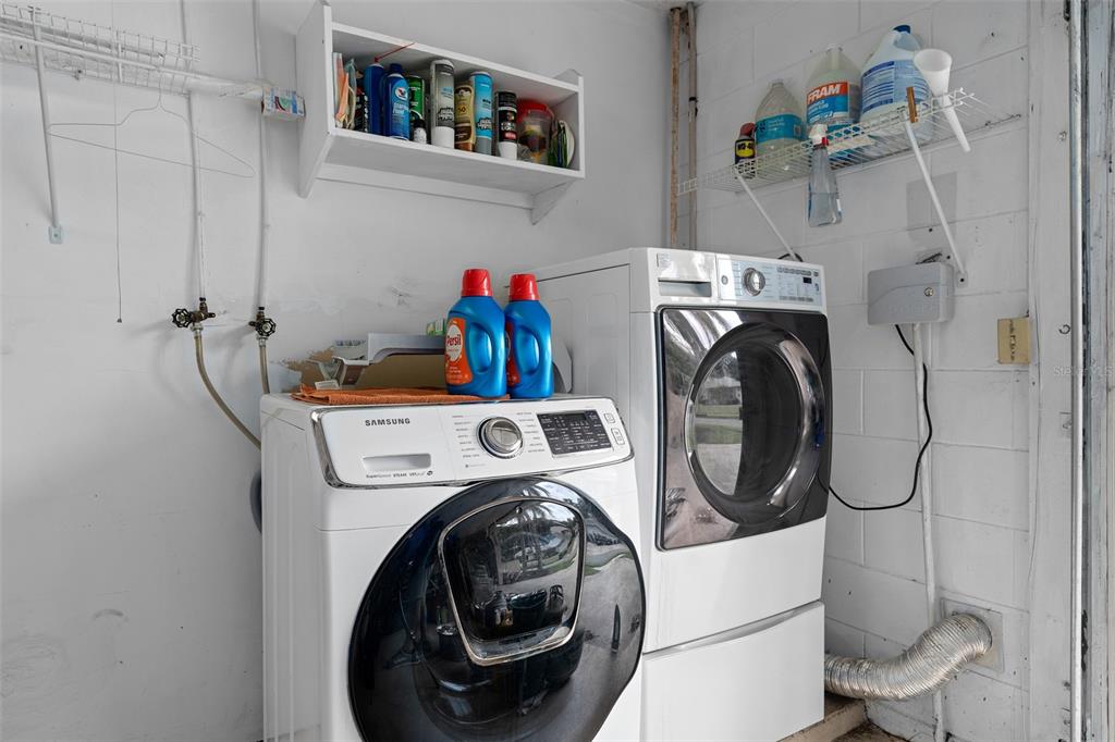744 Cornwall Road Winter Park, FL 32792 - Photo 19 of 57 a utility room with dryer and washer
