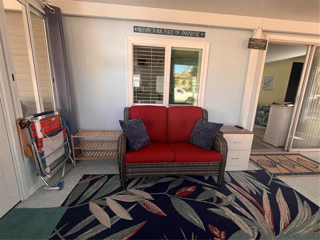 2295 North Beach Road, Unit 23 Englewood, FL 34223 - Photo 12 of 20 a living room with furniture and a window