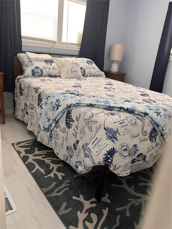 2295 North Beach Road, Unit 23 Englewood, FL 34223 - Photo 9 of 20 a bedroom with a bed and a window