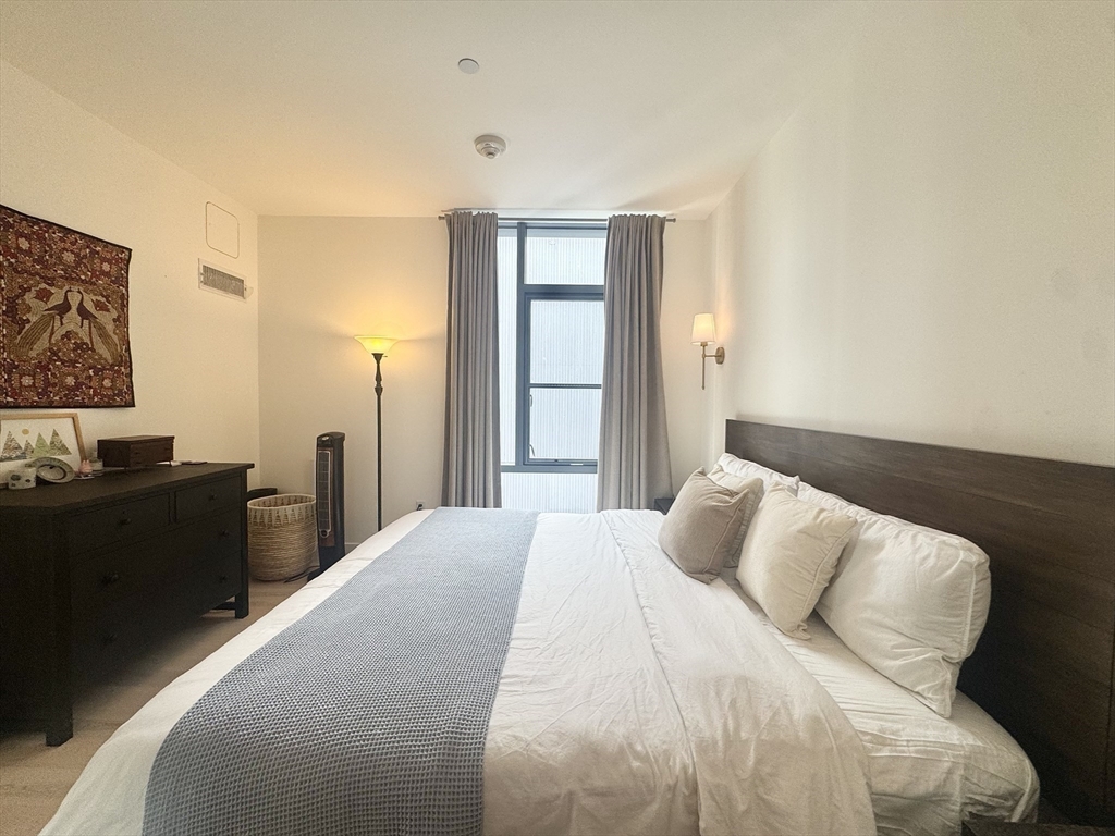 32 Traveler Street, Unit 609 Boston, MA 02118 - Photo 11 of 26 a bedroom with a bed and a window