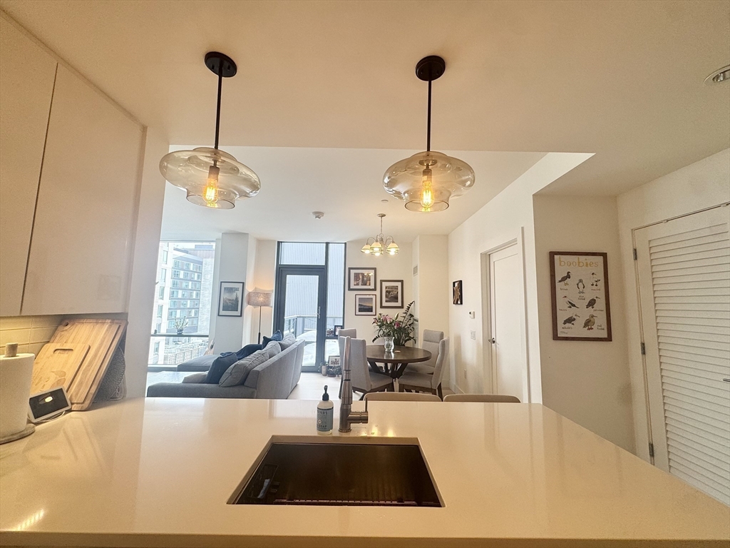 32 Traveler Street, Unit 609 Boston, MA 02118 - Photo 3 of 26 a view of a living room and chandelier