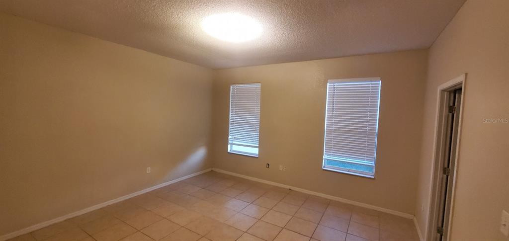 810 Terranova Road Winter Haven, FL 33884 - Photo 6 of 10 a view of an empty room with a window