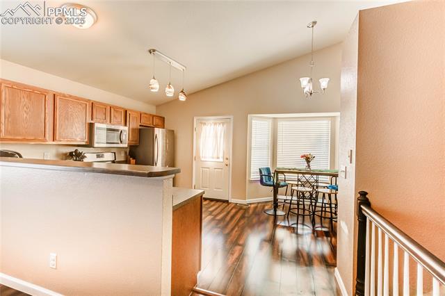 7403 Farmcrest Road Colorado Springs, CO 80925 - Photo 5 of 17 Kitchen and Dining Area