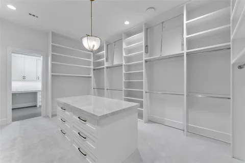 a view of a store room cabinets and a ceiling fan