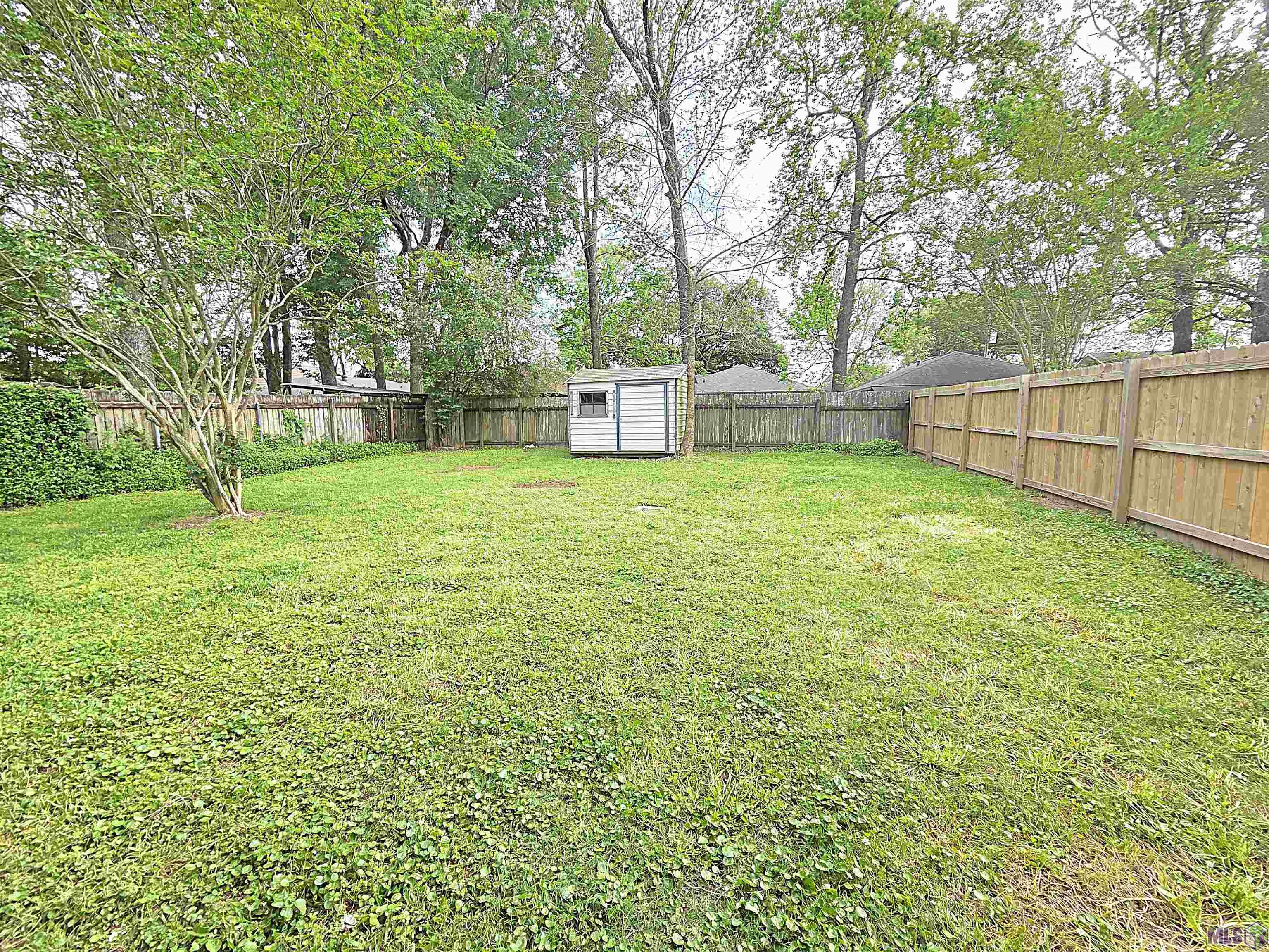 8566 Justin Avenue Baton Rouge, LA 70809 - Photo 14 of 14 Huge Fully Fenced Backyard!