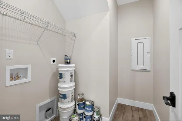 a white toilet sitting next to a bathroom sink and vanity