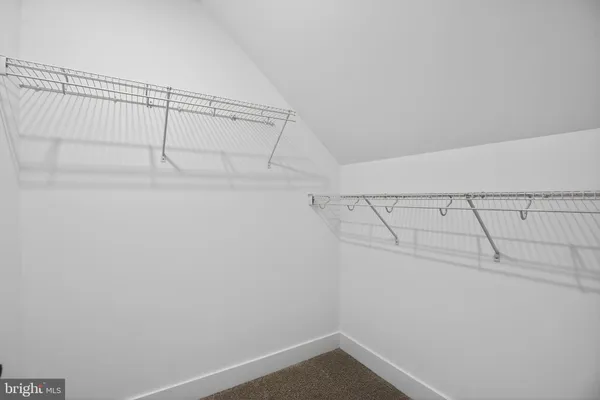 a view of a room with racks on the wall