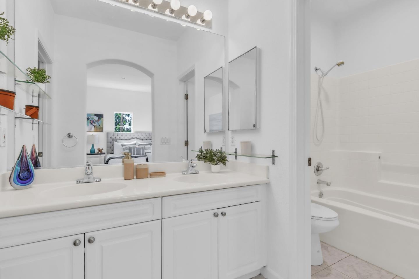 845 Fire Walk Milpitas, CA 95035 - Photo 22 of 40 a bathroom with a double vanity sink toilet and shower