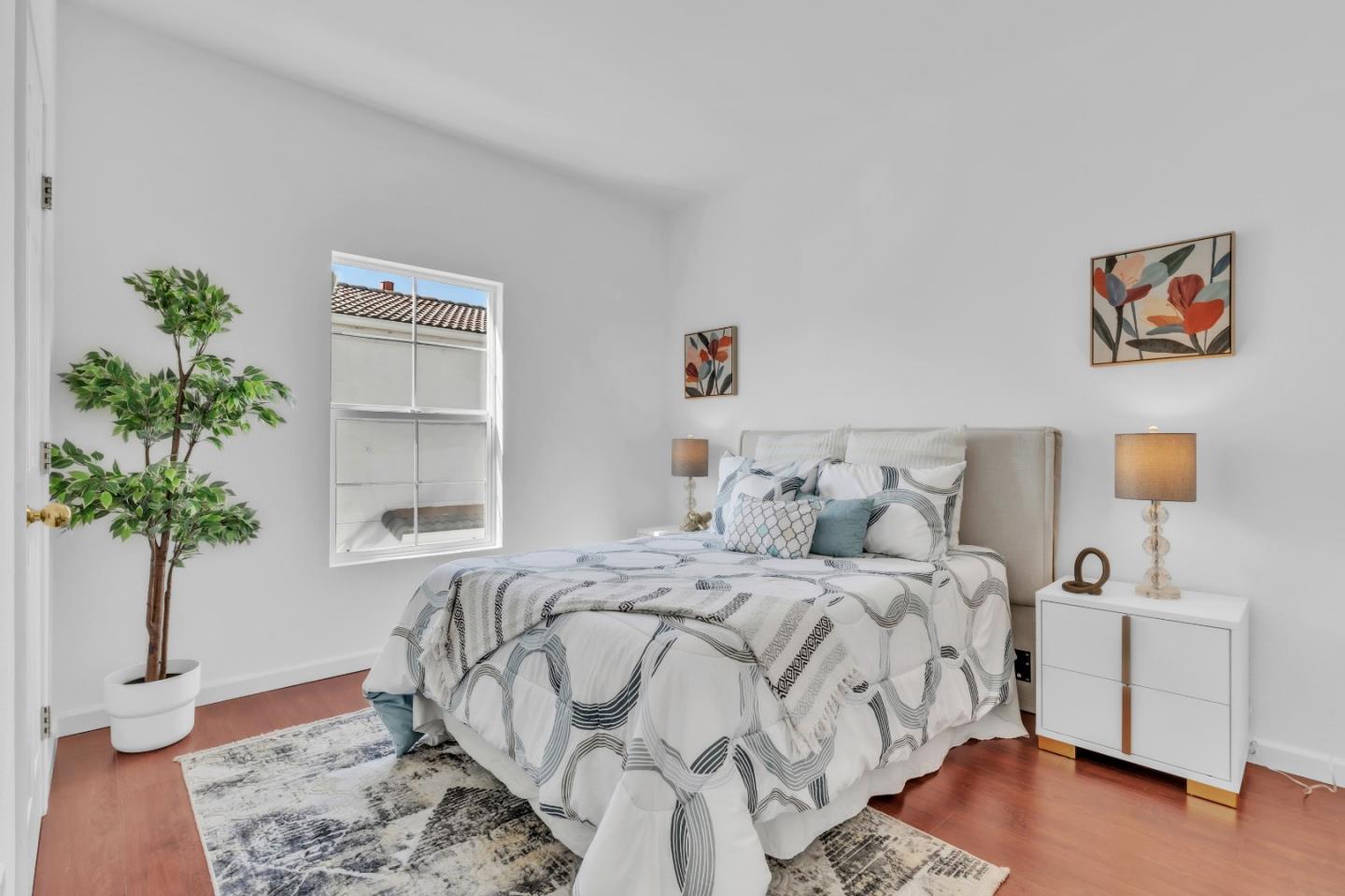 845 Fire Walk Milpitas, CA 95035 - Photo 24 of 40 a bedroom with a bed and a potted plant