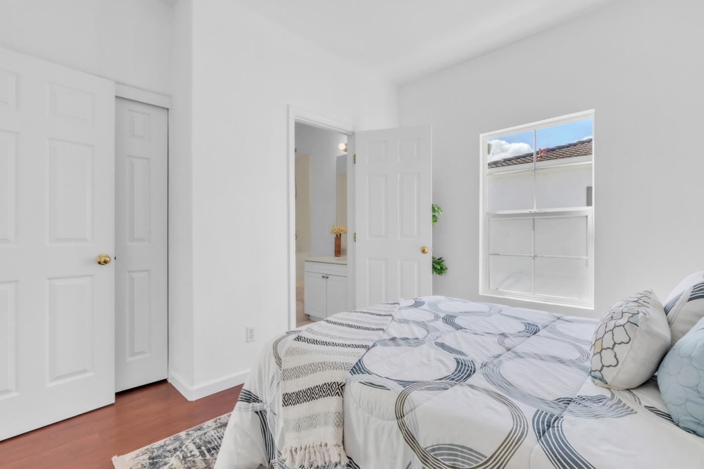 845 Fire Walk Milpitas, CA 95035 - Photo 25 of 40 a bedroom with a bed and a window