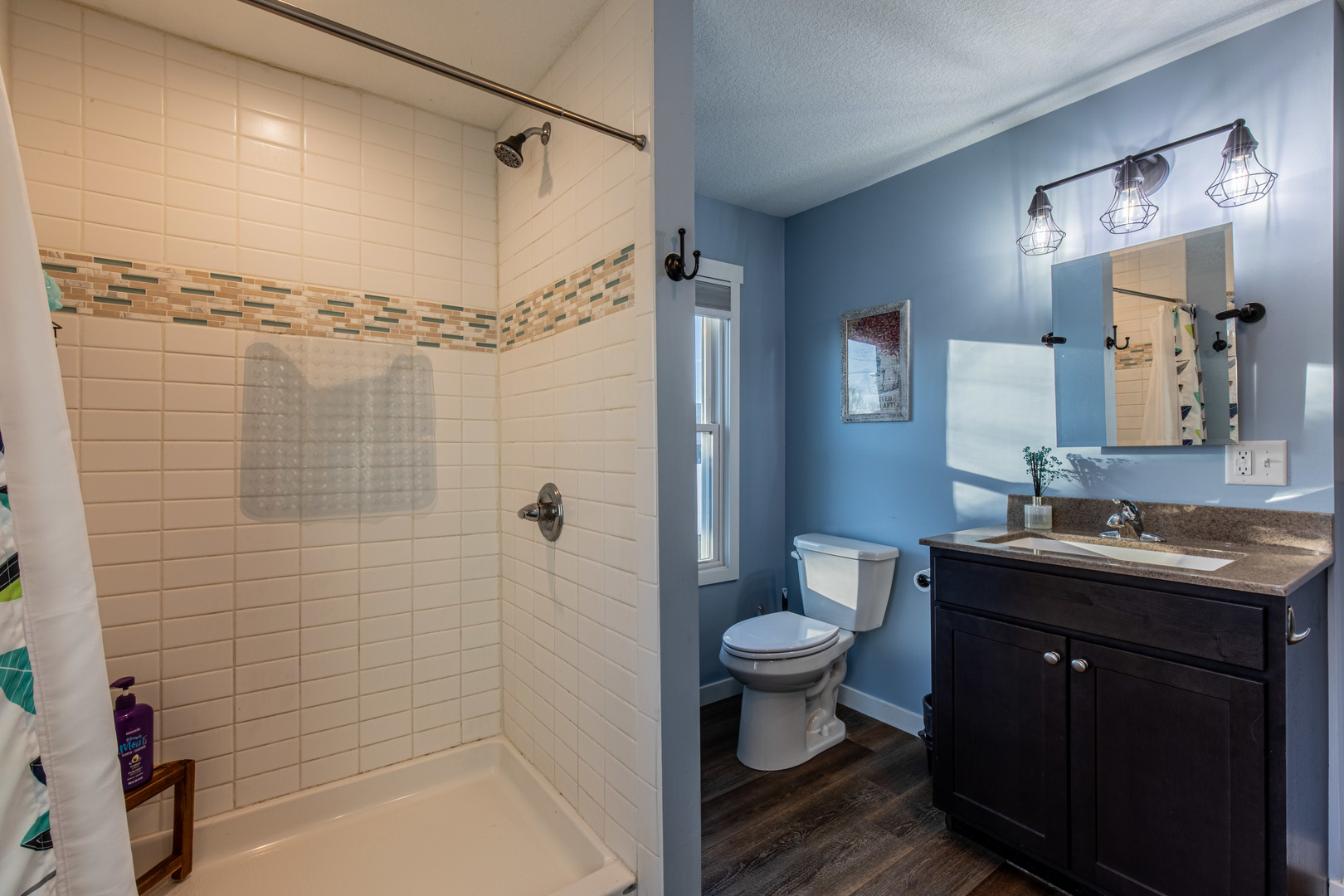 220 2nd Street Wyanet, IL 61379 - Photo 11 of 27 a bathroom with a sink a toilet and shower