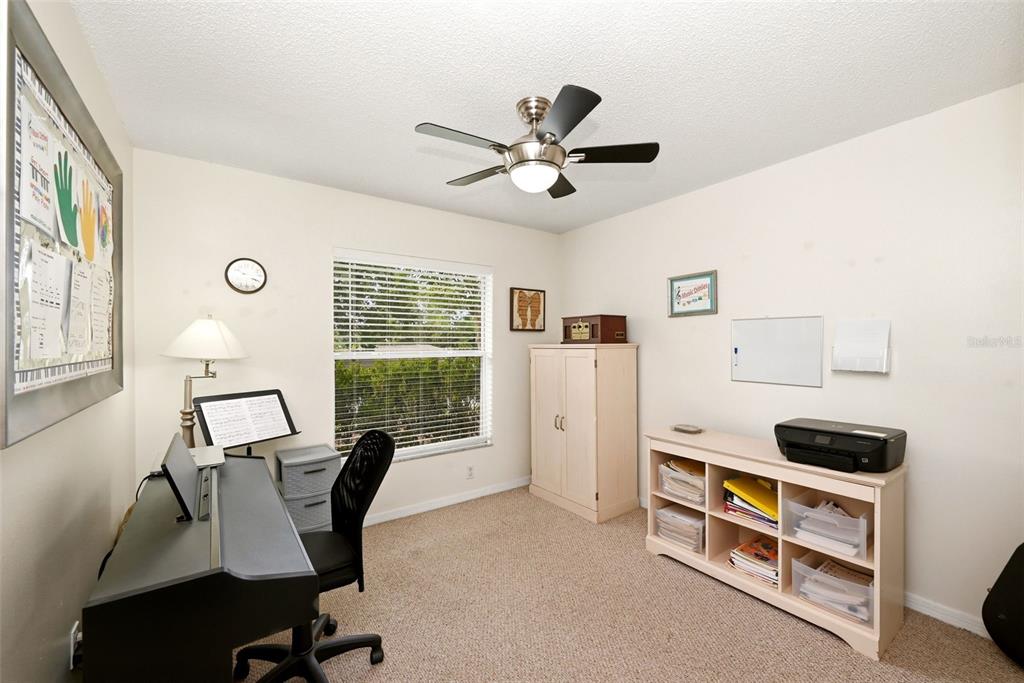 10618 Lake Ralph Drive Clermont, FL 34711 - Photo 16 of 26 a view of a workspace with furniture and a window
