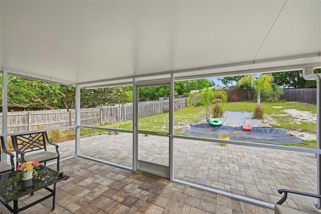 10618 Lake Ralph Drive Clermont, FL 34711 - Photo 17 of 26 a view of swimming pool with a table and chairs in front of it