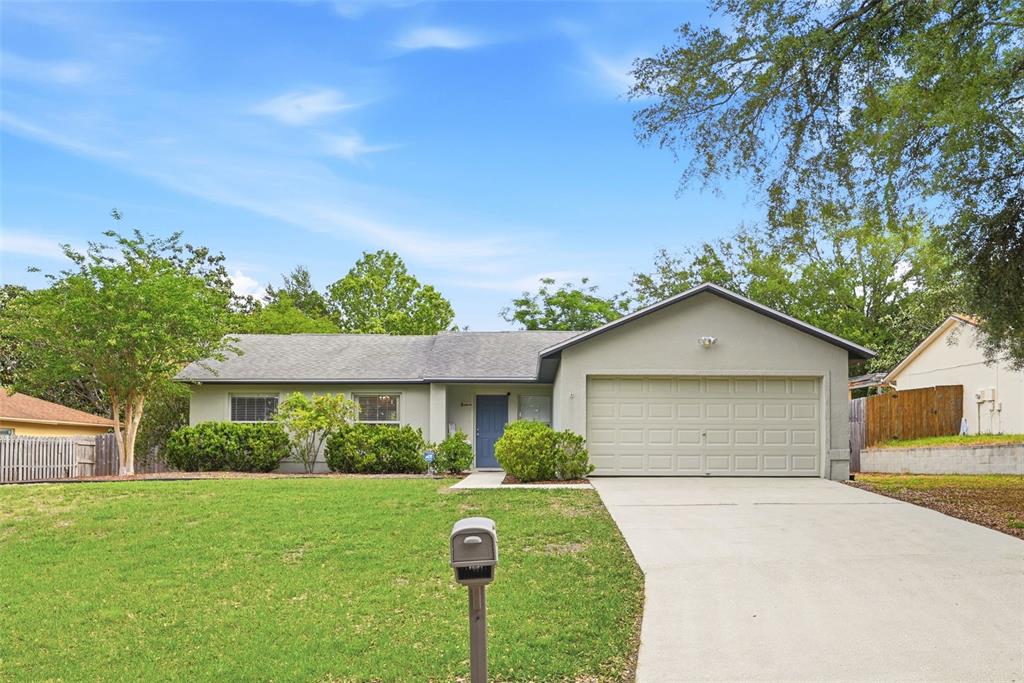 10618 Lake Ralph Drive Clermont, FL 34711 - Photo 2 of 26 a front view of a house with a yard