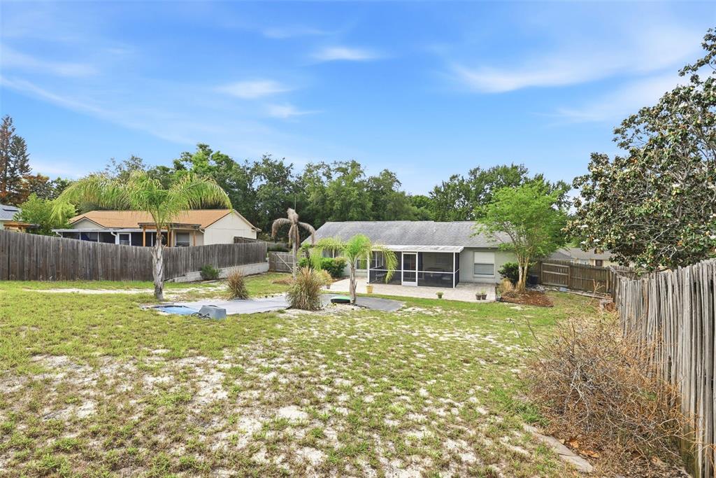 10618 Lake Ralph Drive Clermont, FL 34711 - Photo 22 of 26 a front view of a house with a yard