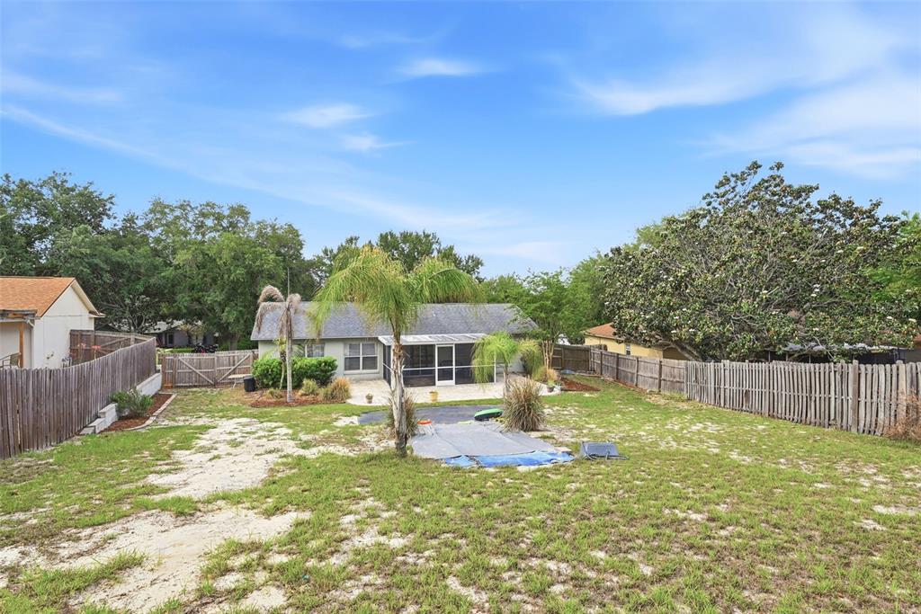 10618 Lake Ralph Drive Clermont, FL 34711 - Photo 23 of 26 a view of a house with a yard balcony and sitting area