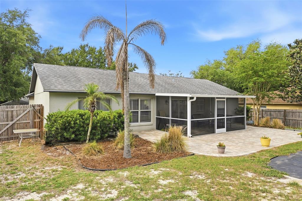 10618 Lake Ralph Drive Clermont, FL 34711 - Photo 24 of 26 a view of a house with backyard and sitting area