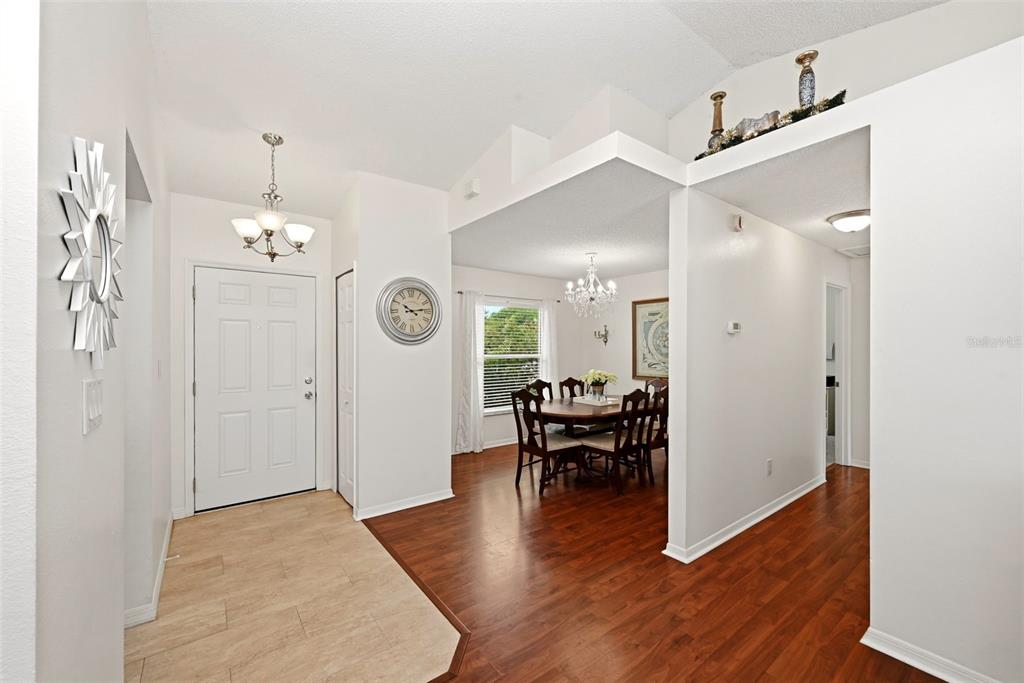 10618 Lake Ralph Drive Clermont, FL 34711 - Photo 4 of 26 a view of a livingroom with furniture wooden floor and a chandelier