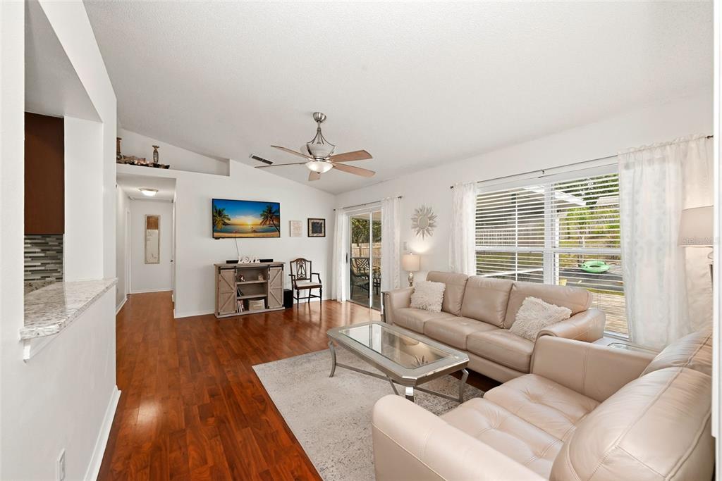 10618 Lake Ralph Drive Clermont, FL 34711 - Photo 8 of 26 a living room with furniture and a fireplace