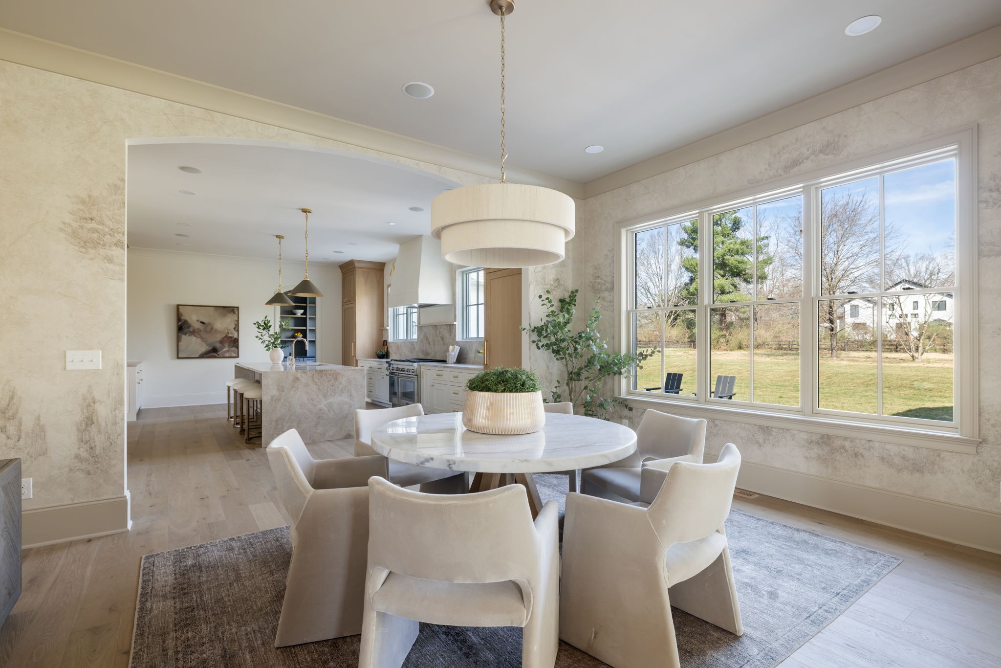 8238 Alamo Road Brentwood, TN 37027 - Photo 11 of 64 a dining room with furniture large windows and a chandelier