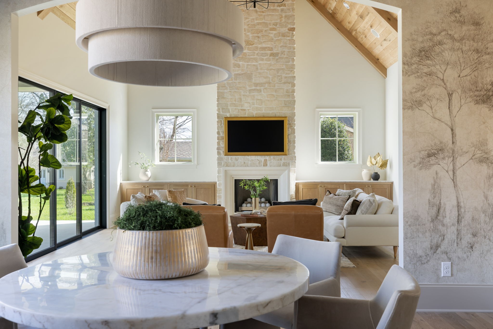 8238 Alamo Road Brentwood, TN 37027 - Photo 23 of 64 a living room with furniture a large window and a chandelier