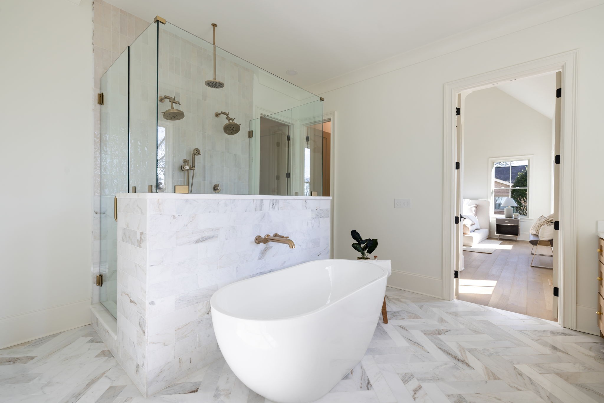 8238 Alamo Road Brentwood, TN 37027 - Photo 34 of 64 a white bath tub sitting in a bathroom and mirror