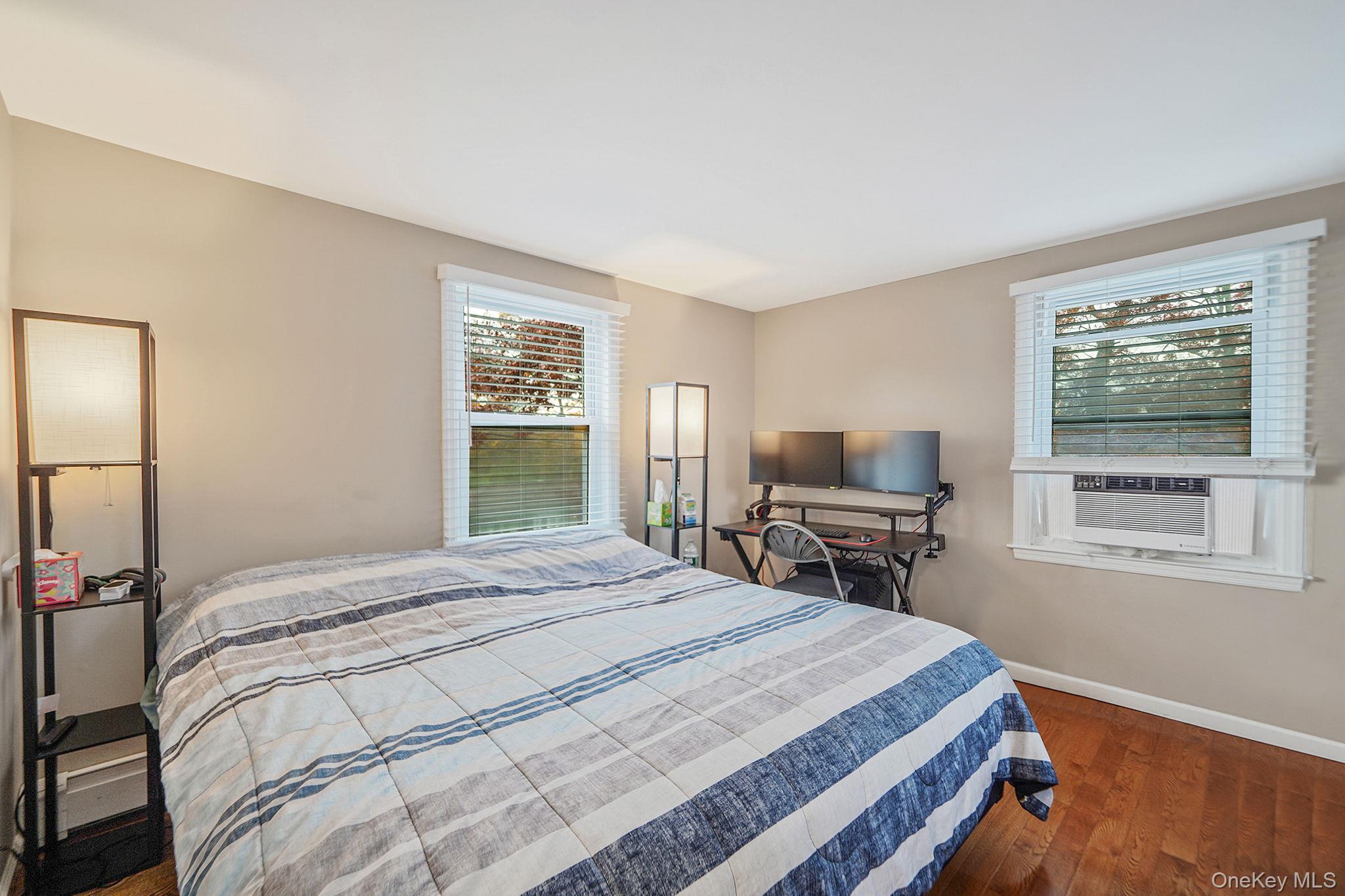 4 Willow Road Rocky Point, NY 11778 - Photo 18 of 30 Bedroom with dark wood-type flooring and cooling unit