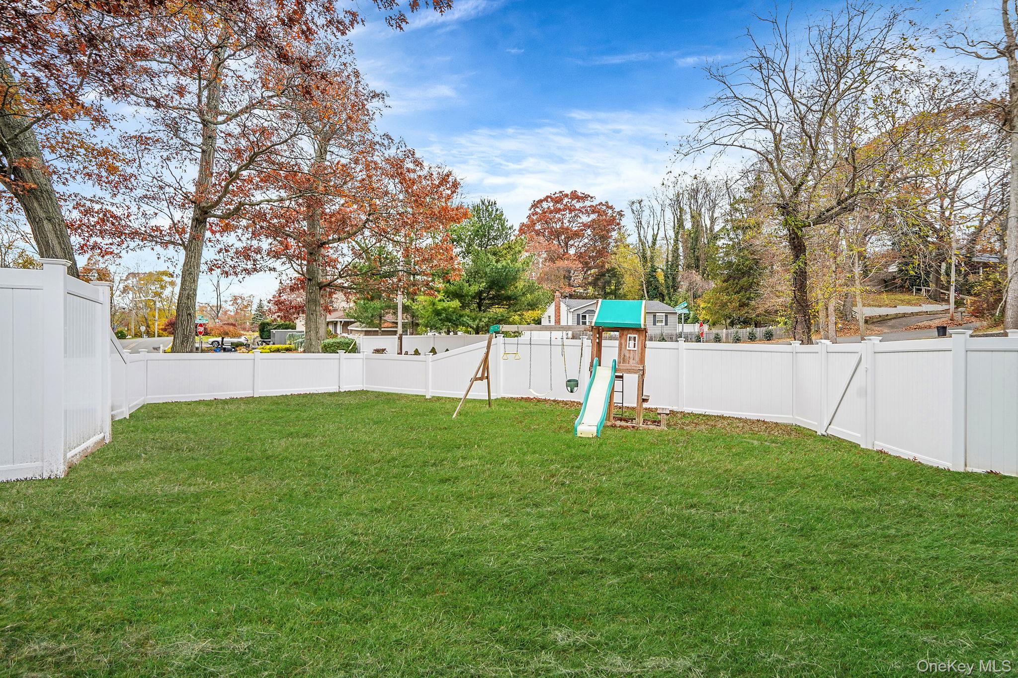 4 Willow Road Rocky Point, NY 11778 - Photo 26 of 30 Fenced backyard featuring a playground