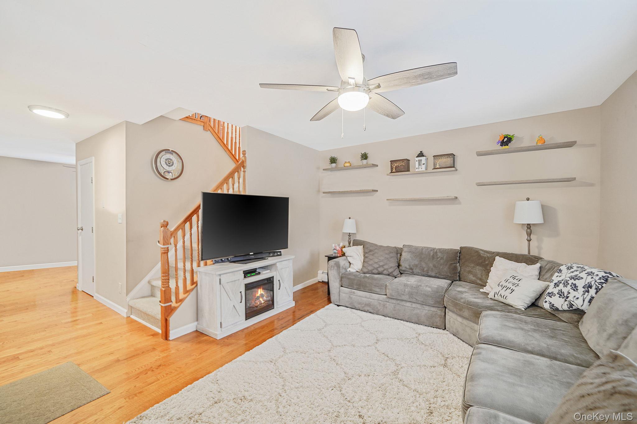 4 Willow Road Rocky Point, NY 11778 - Photo 6 of 30 Living room featuring light wood-type flooring, stairs, a ceiling fan, and recessed lighting