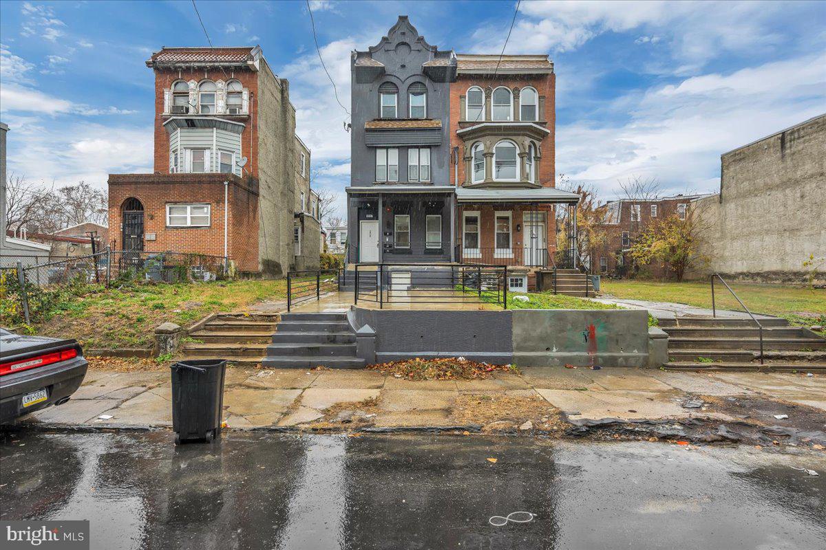 1917 West Venango Street Philadelphia, PA 19140 - Photo 22 of 24 a view of a building with a yard