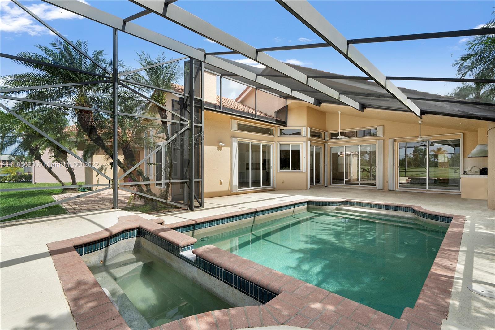 2660 Palmer Place Weston, FL 33332 - Photo 17 of 22 a view of a house with pool and sitting area