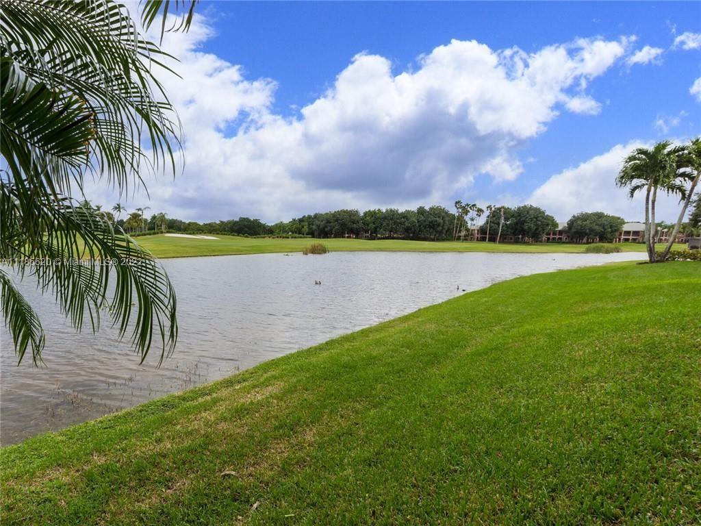 2660 Palmer Place Weston, FL 33332 - Photo 19 of 22 a view of a lake and a yard