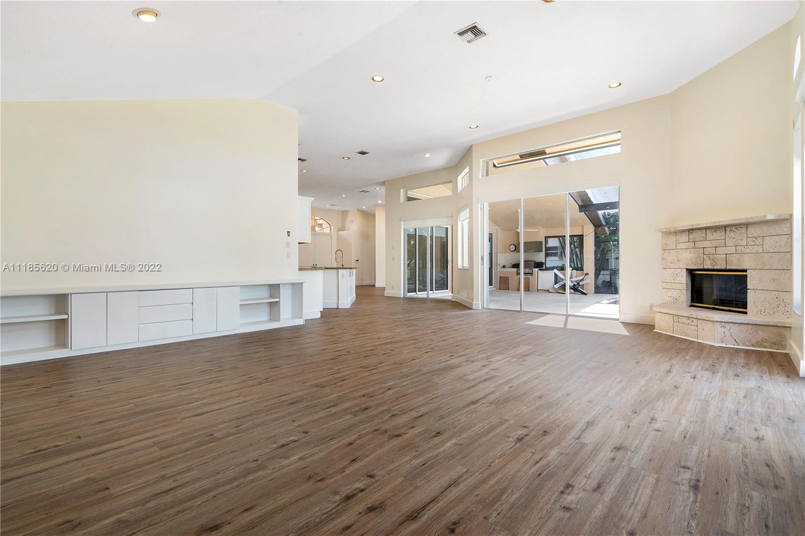 2660 Palmer Place Weston, FL 33332 - Photo 4 of 22 a view of a hall with wooden floor