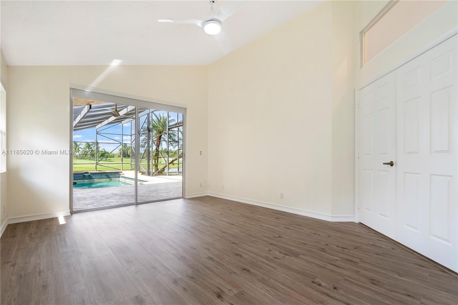 2660 Palmer Place Weston, FL 33332 - Photo 10 of 22 wooden floor in an empty room with a window