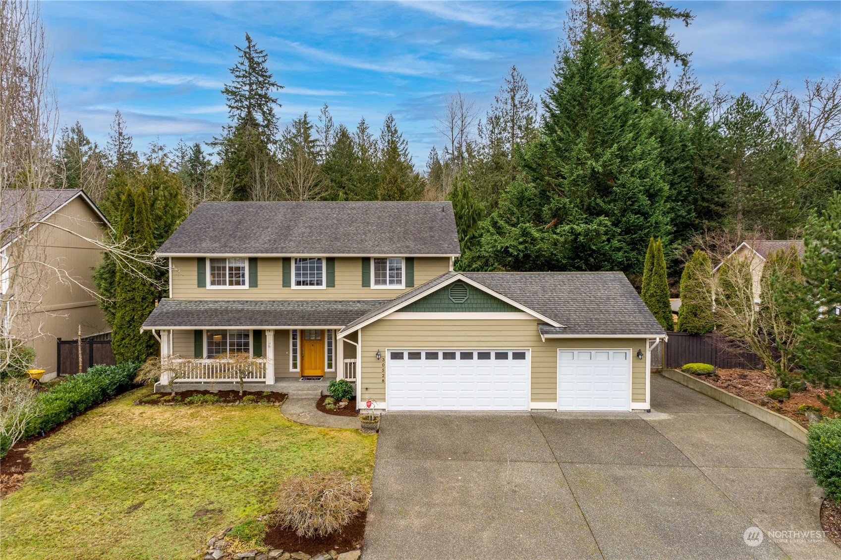 front view of a house with a yard